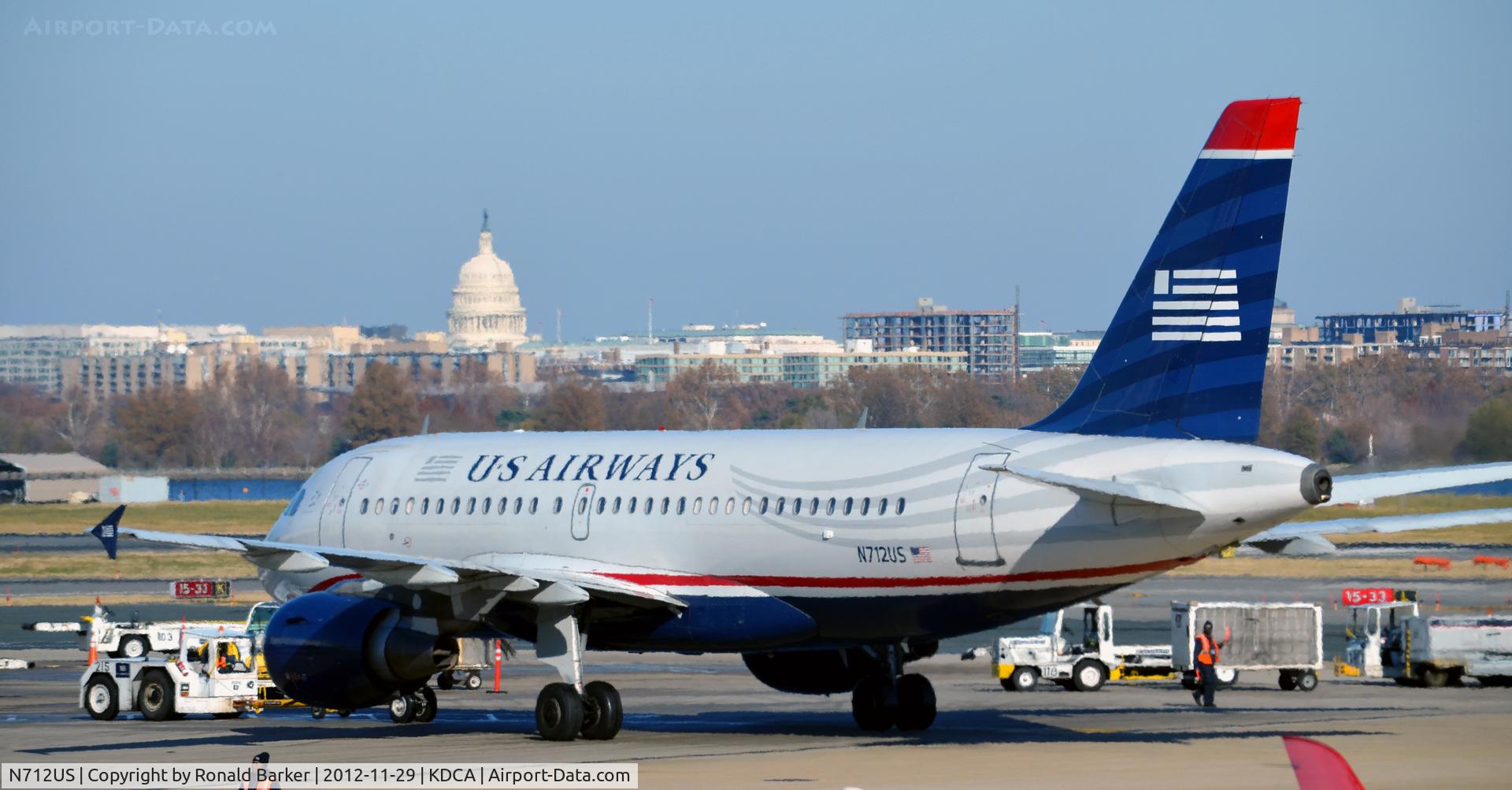 N712US, 1999 Airbus A319-112 C/N 1038, Push back with US Capitol in background
