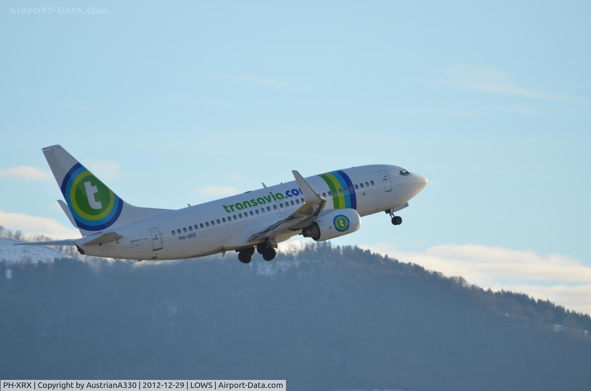 PH-XRX, 2003 Boeing 737-7K2 C/N 33464, Take off at Salzburg. In the middle of the alps!