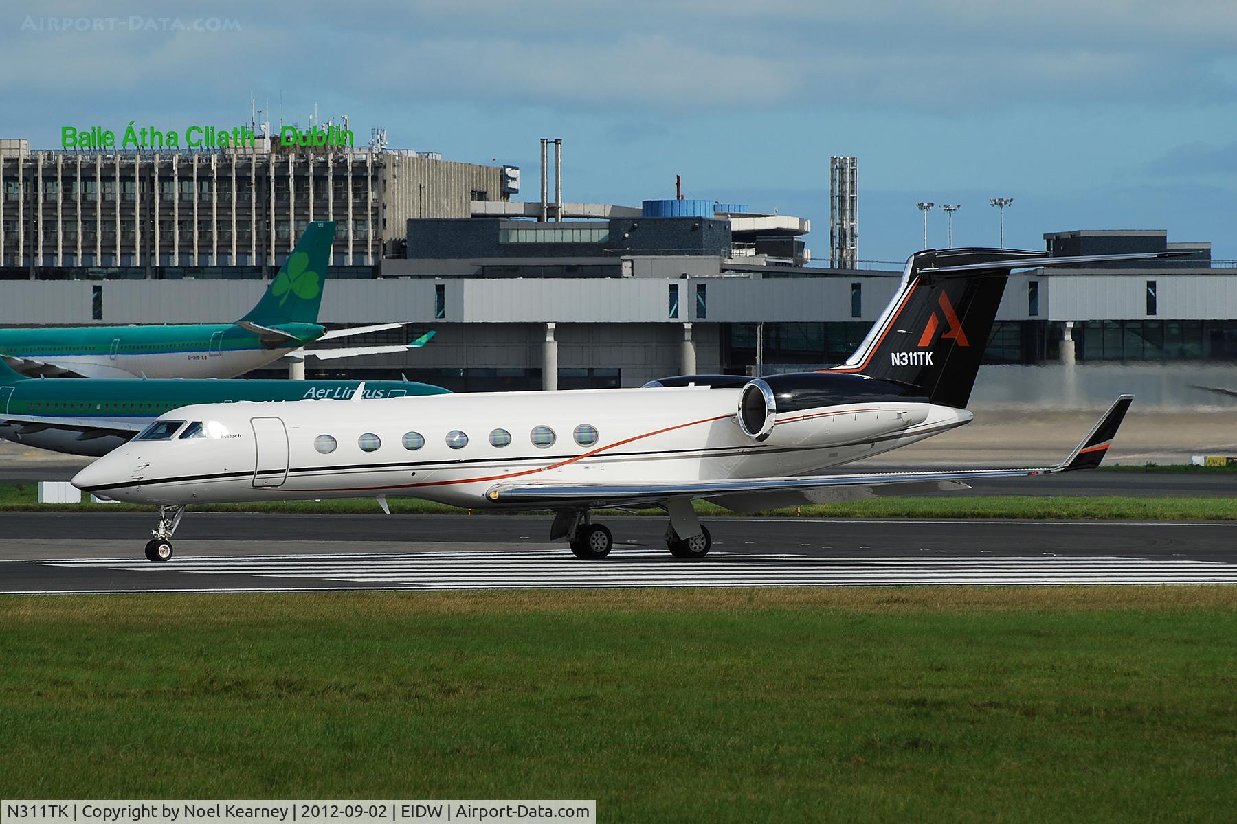 N311TK, 2003 Gulfstream Aerospace GV-SP (G550) C/N 5028, Photographed about to depart off Rwy 28 at EIDW.