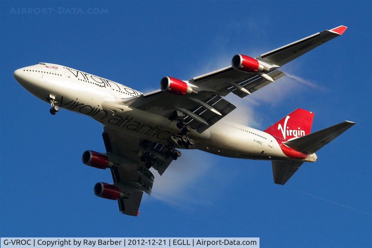 G-VROC, 2003 Boeing 747-41R C/N 32746, Boeing 747-41R [32746] (Virgin Atlantic) Home~G 21/12/2012. Seen here in new scheme with Virgin Atlantic titles on the belly. Visual effect of water droplets passing over the wings of the aircraft added some difference to this shot.