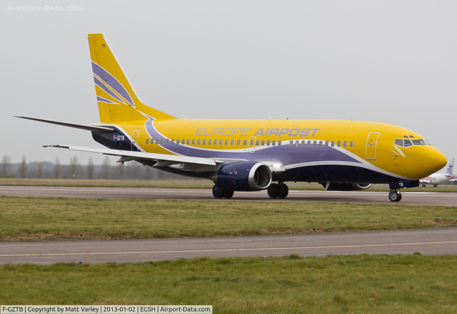 F-GZTB, 1999 Boeing 737-33V C/N 29336, Departing EGSH after spray.
