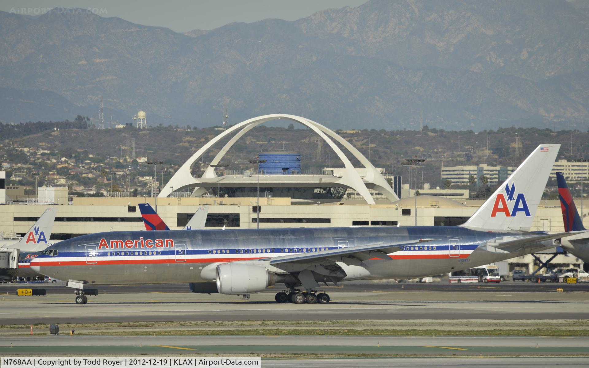 N768AA, 2006 Boeing 777-223 C/N 33540, taxiing to gate after landing on 25R
