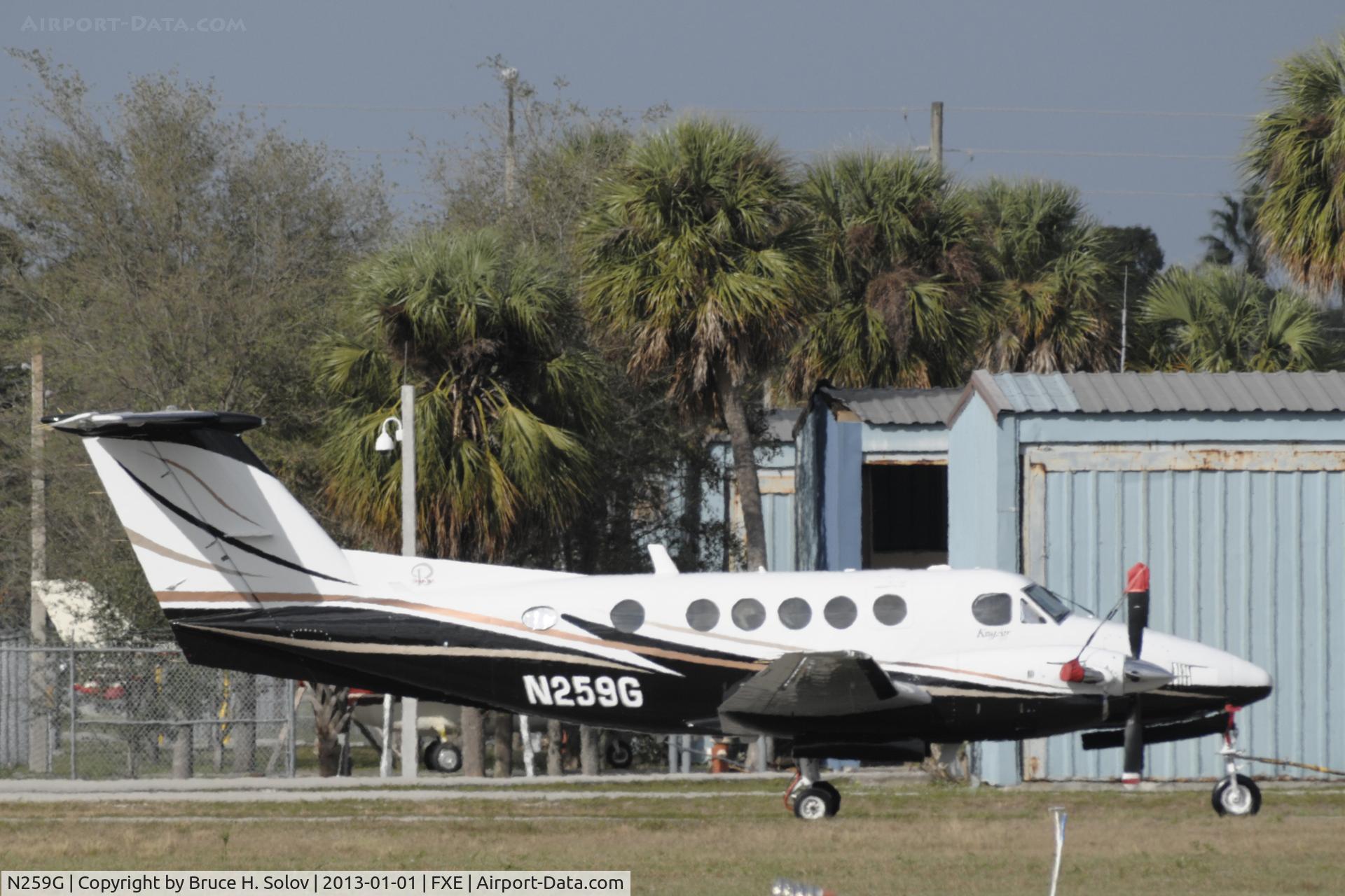 N259G, 1975 Beech 200 Super King Air C/N BB-62, At KFXE being towed by a tug