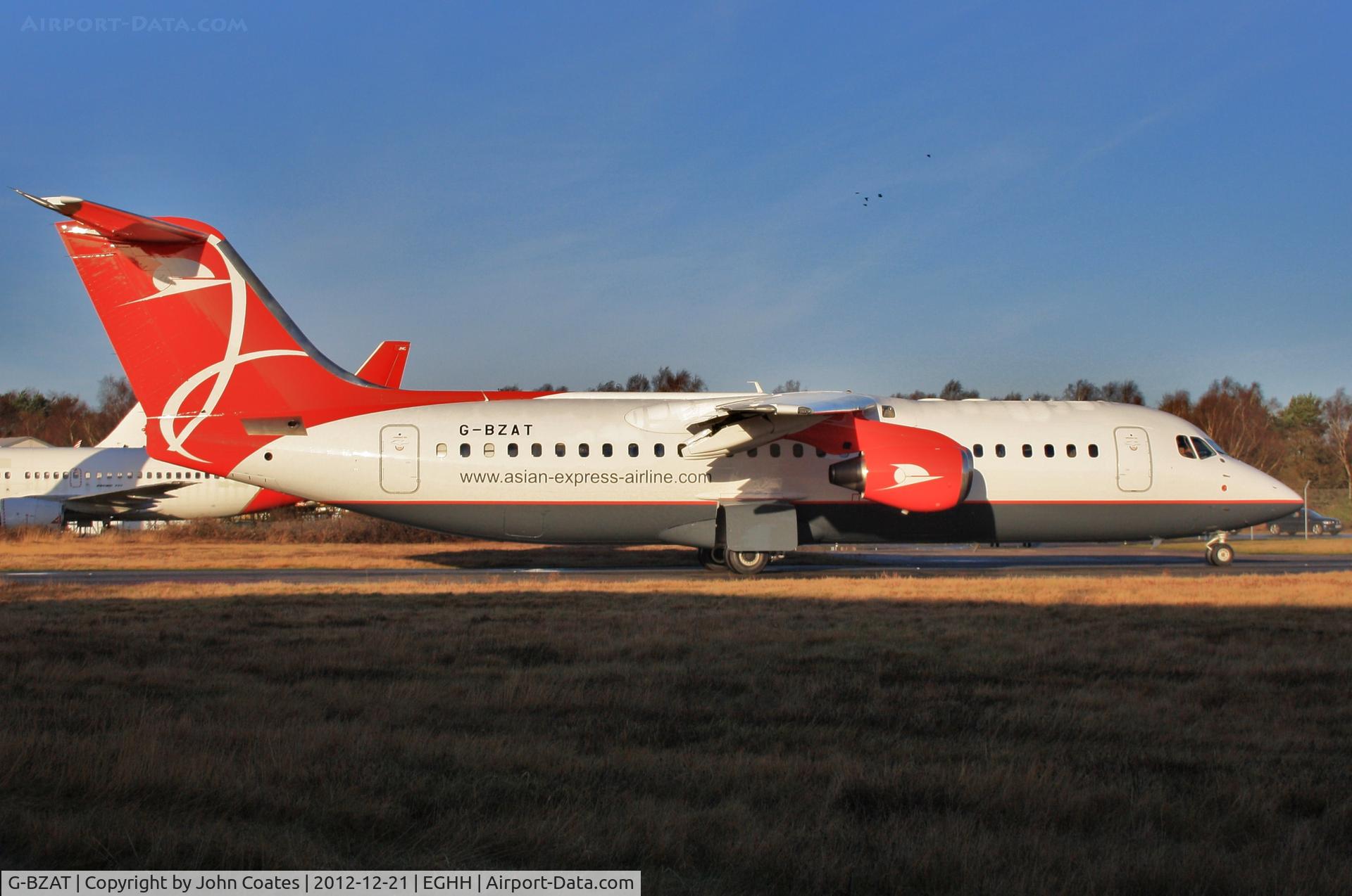 G-BZAT, 1997 British Aerospace Avro 146-RJ100 C/N E3320, Taxiing to depart after respray into Asian Express Airline colours.