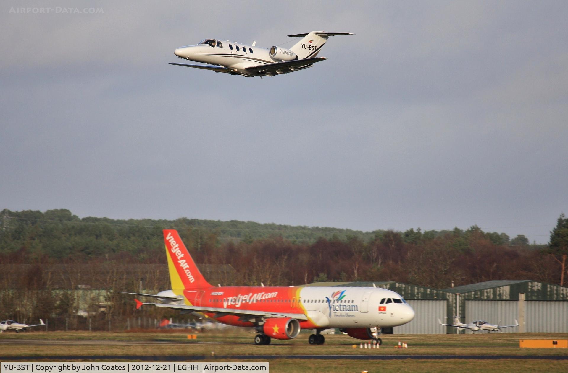 YU-BST, 1993 Cessna 525 CitationJet CJ1 C/N 525-0022, ex G-THNX departs over waiting VietJet Air A 320 SX-OAU.