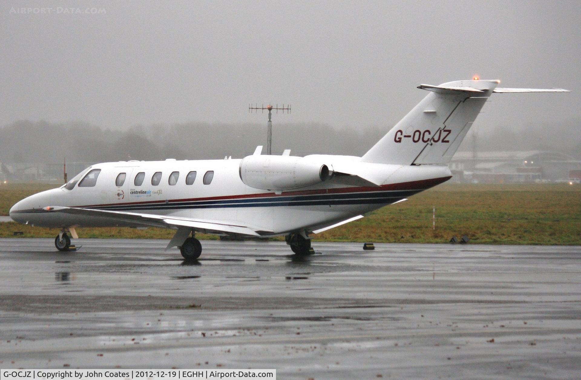 G-OCJZ, 1994 Cessna 525A CitationJet CJ2 C/N 525A-0051, In pouring rain at Citation Centre