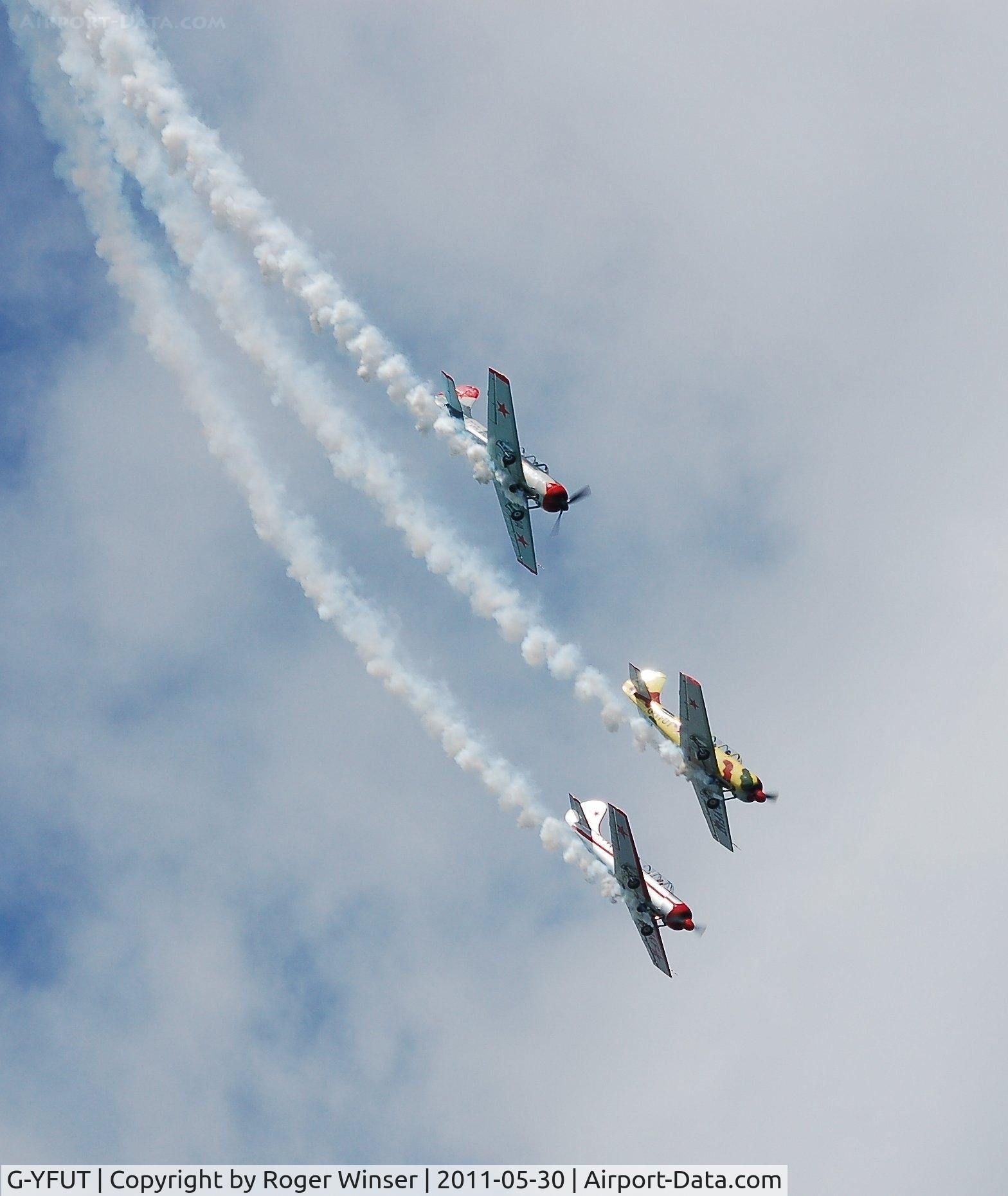 G-YFUT, 1988 Bacau Yak-52 C/N 888410, Off airport. Leading Team Osprey out of a loop at the 2011 Mumbles Navy Days display, Swansea Bay, Wales, UK.