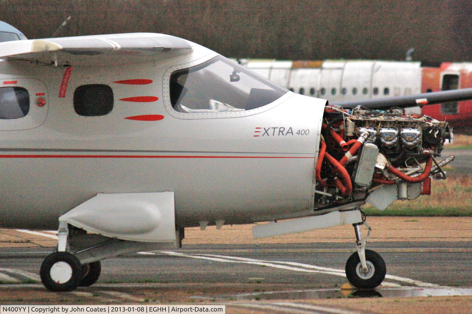 N400YY, 2001 Extra EA-400 C/N 019, Receiving attention at Airtime