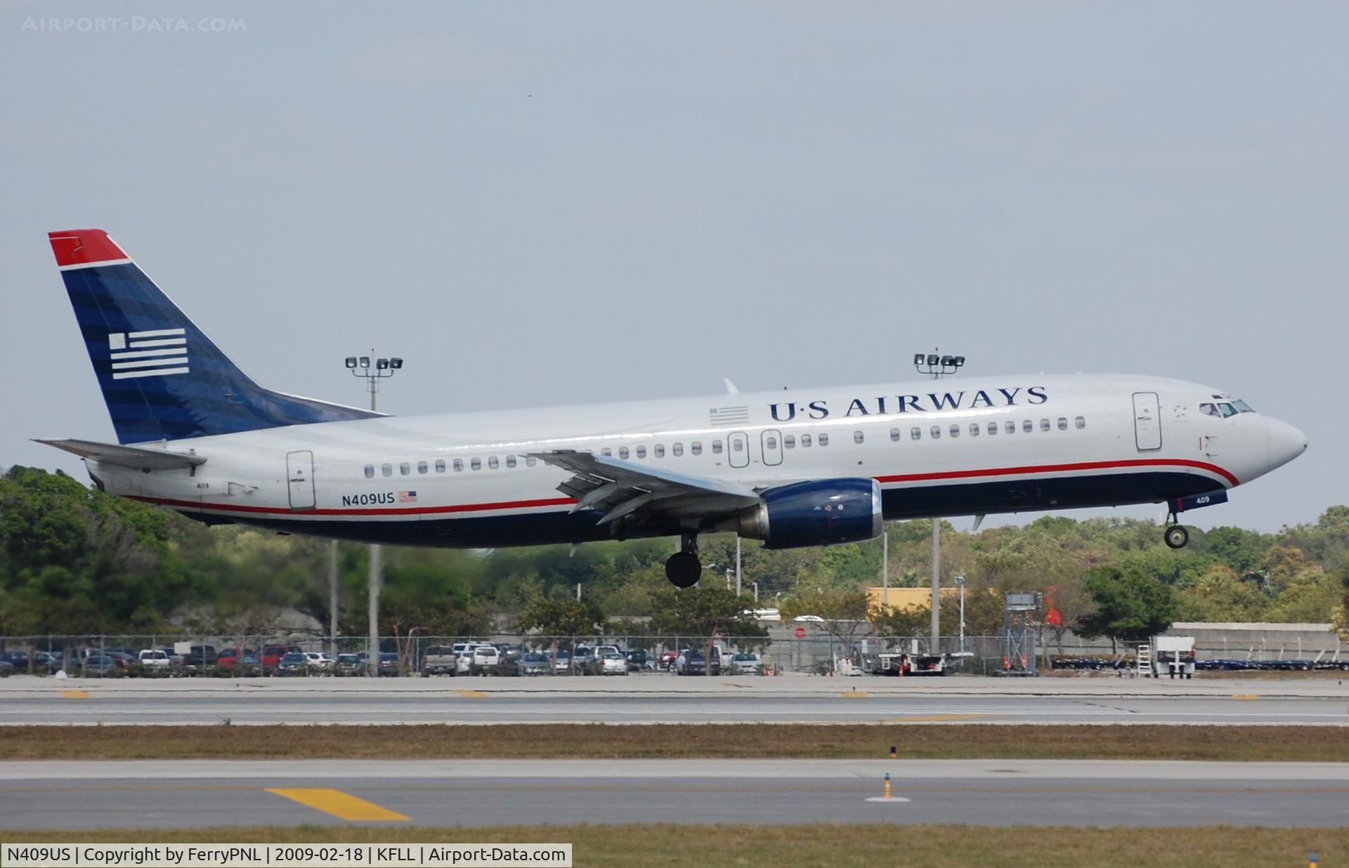 N409US, 1988 Boeing 737-401 C/N 23879, US B734 landing in FLL