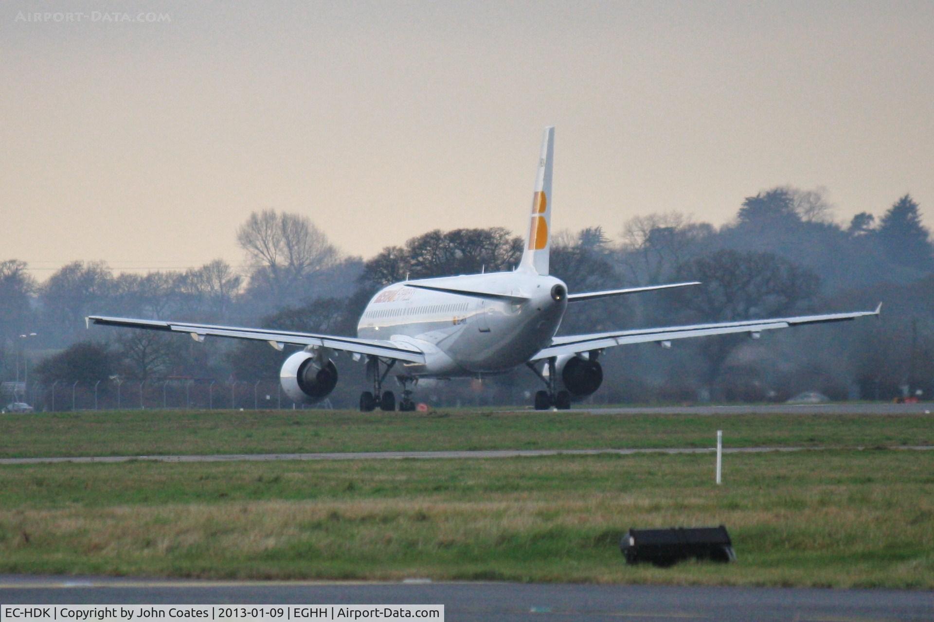 EC-HDK, 1999 Airbus A320-214 C/N 1067, Backtracking through the mist on 08 to depart after respray