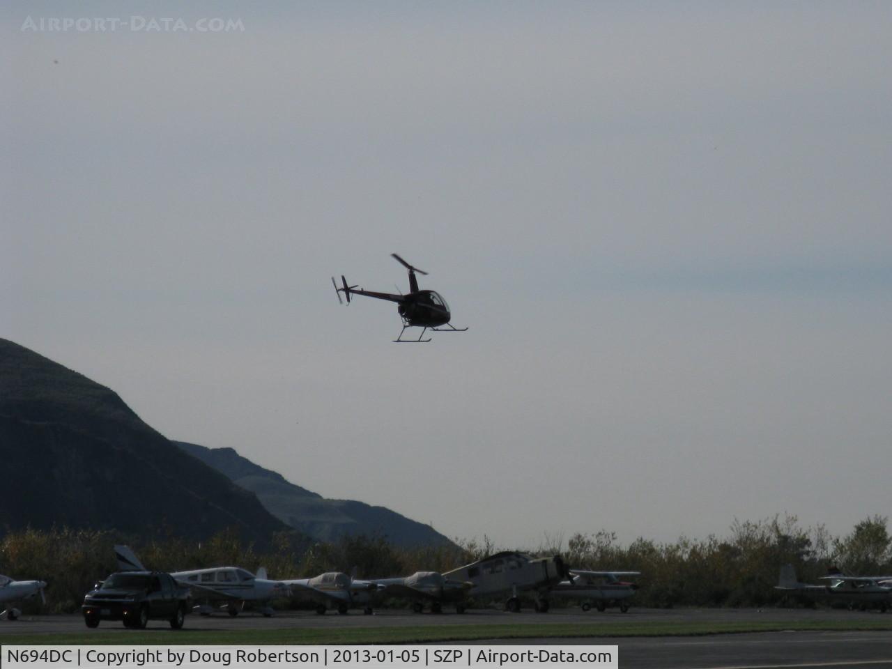 N694DC, 2004 Robinson R22 Beta C/N 3573, 2004 Robinson R22 BETA II, Lycoming O-360 derated to 131 Hp, approach from river route to land at west end
