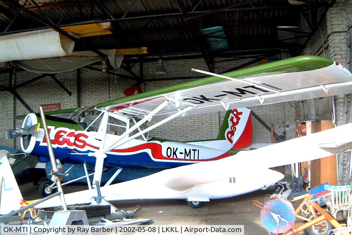 OK-MTI, 1958 Aero L-60S Brigadyr C/N 150815, Orlican L-60S Brigadyr [150815] Kladno~OK 08/05/2002. Tucked away in the back of a cluttered hangar.