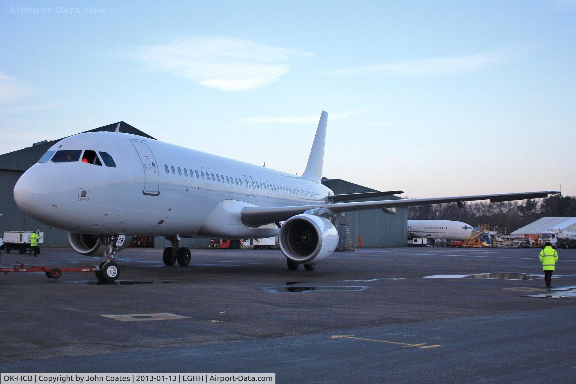 OK-HCB, 2004 Airbus A320-214 C/N 2180, Exiting paintshop after respray all white for lease to NAS Air, Saudi Arabia.