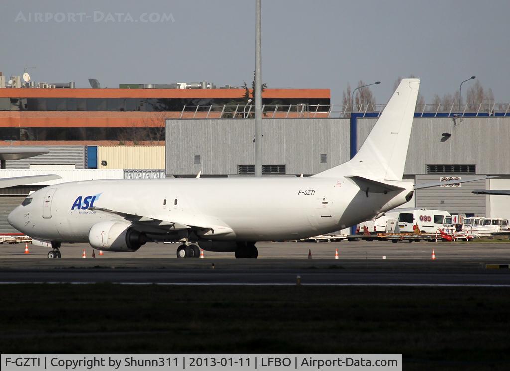 F-GZTI, 1991 Boeing 737-408 C/N 25063, Parked at the Cargo apron with additional 'ASL' titles on left side only...