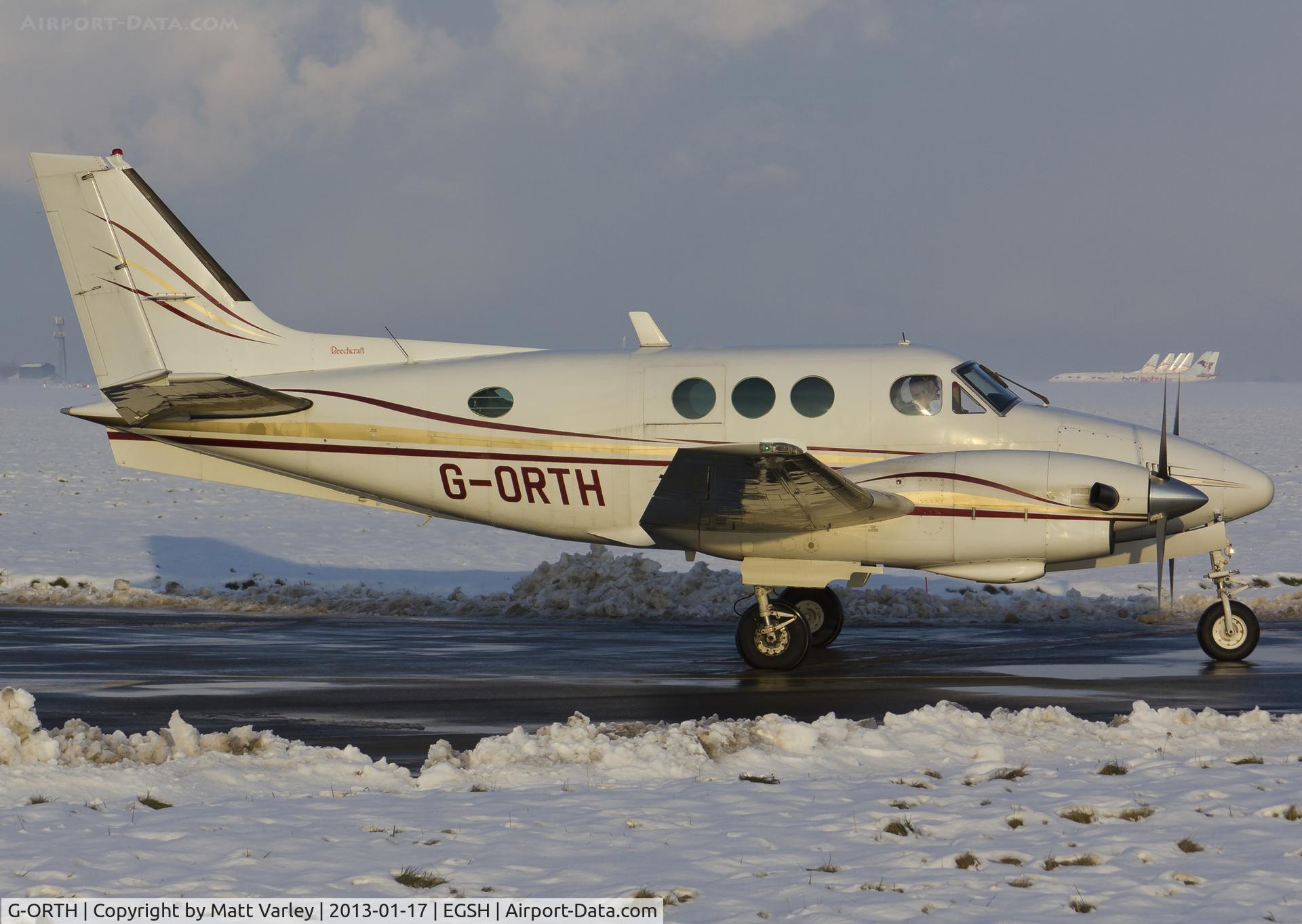 G-ORTH, 1975 Beech E90 King Air C/N LW-136, Departing a snowy SaxonAir