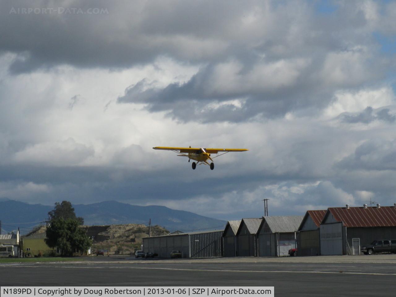 N189PD, Cub Crafters CC11-160 Carbon Cub SS C/N CC11-00189, 2011 Cubcrafters CC11-160 CARBON CUB, Lycoming O-360-based CC340 with O-320 cylinders rated 180 Hp for 5 minutes, 80 Hp cruise, on final for STOL Rwy 22L grass, full flaps stall speed @28 kts.