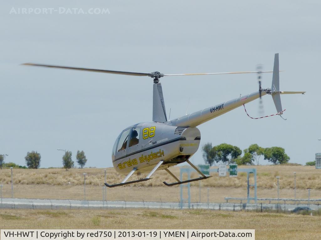 VH-HWT, 2007 Robinson R44 Raven C/N 1670, VH-HWT at YMEN. Took off just before I got to the fence.
