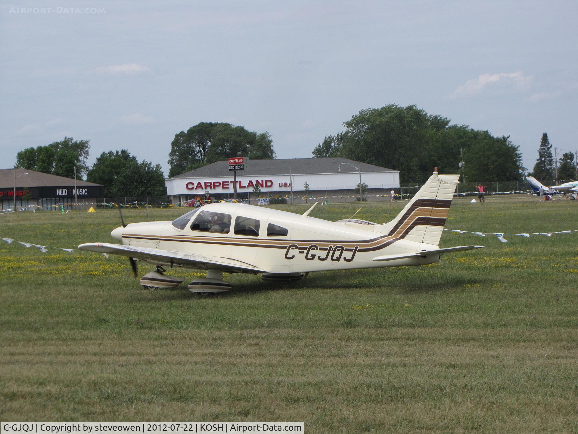 C-GJQJ, 1977 Piper PA-28-181 Cherokee Archer II C/N 28-7790334, in the grass taxi way at Oshkosh