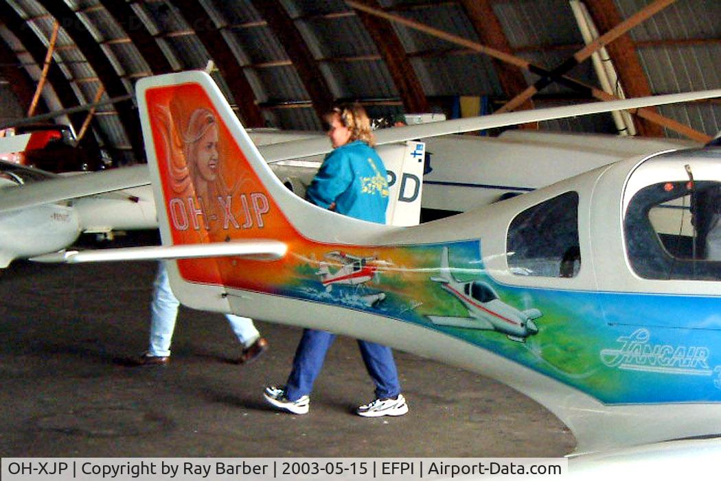 OH-XJP, Lancair 320 C/N 169, Lancair 320 [169] Piikajarvi~OH 15/05/2003. Showing the rear art work on this side of the aircraft.
