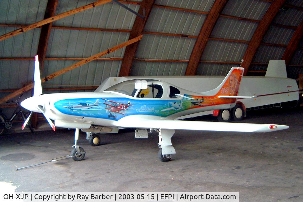 OH-XJP, Lancair 320 C/N 169, Lancair 320 [169] Piikajarvi~OH 15/05/2003. Showing the full art work on this side of the aircraft all are different.