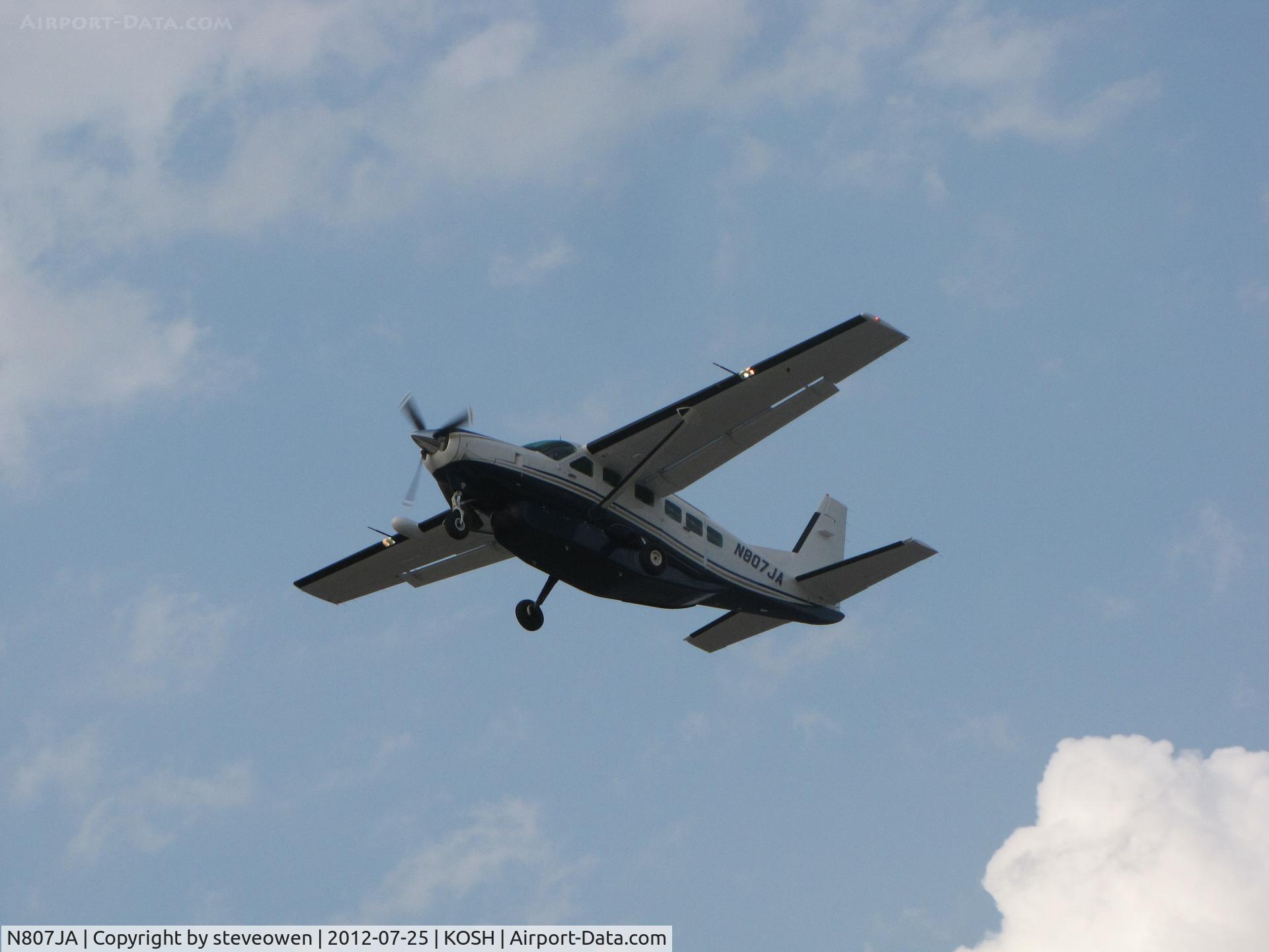N807JA, 1985 Cessna 208 Caravan I C/N 20800075, departing Oshkosh