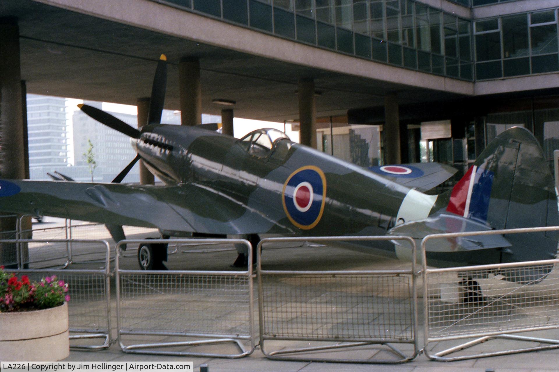 LA226, 1945 Supermarine 356 Spitfire F.21 C/N SMAF.4371, Milbank Tower, July 1976.