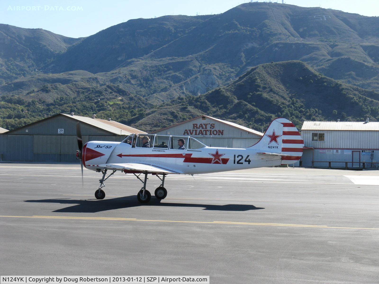 N124YK, 1984 Yakovlev Yak-52 C/N 844804, 1984 Intreprinderea de Avioane Bacau-Romania (Yakovlev) YAK 52, Vedeneev MP-14P 9 cylinder air-cooled radial 360 Hp, Experimental class, taxi to Rwy 22