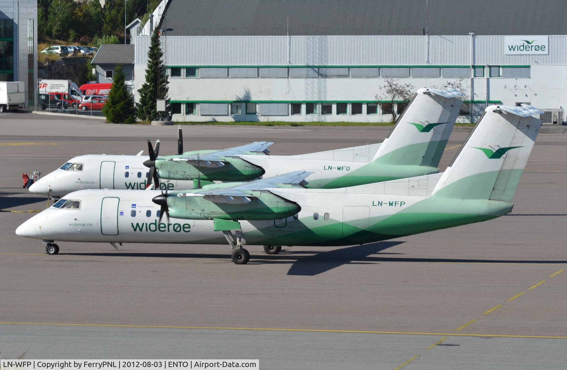 LN-WFP, 1998 De Havilland Canada DHC-8-311Q Dash 8 C/N 495, Wideroe's Dash8 parks next to sistership