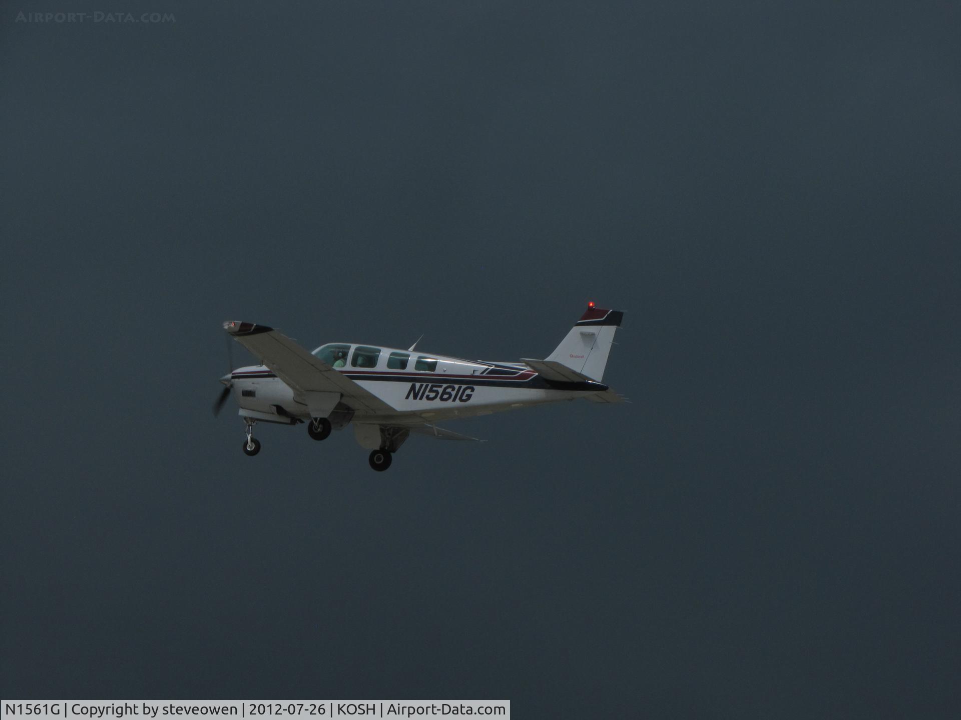 N1561G, 1994 Beech A36 Bonanza 36 C/N E-2854, heading out in a dark stormy sky