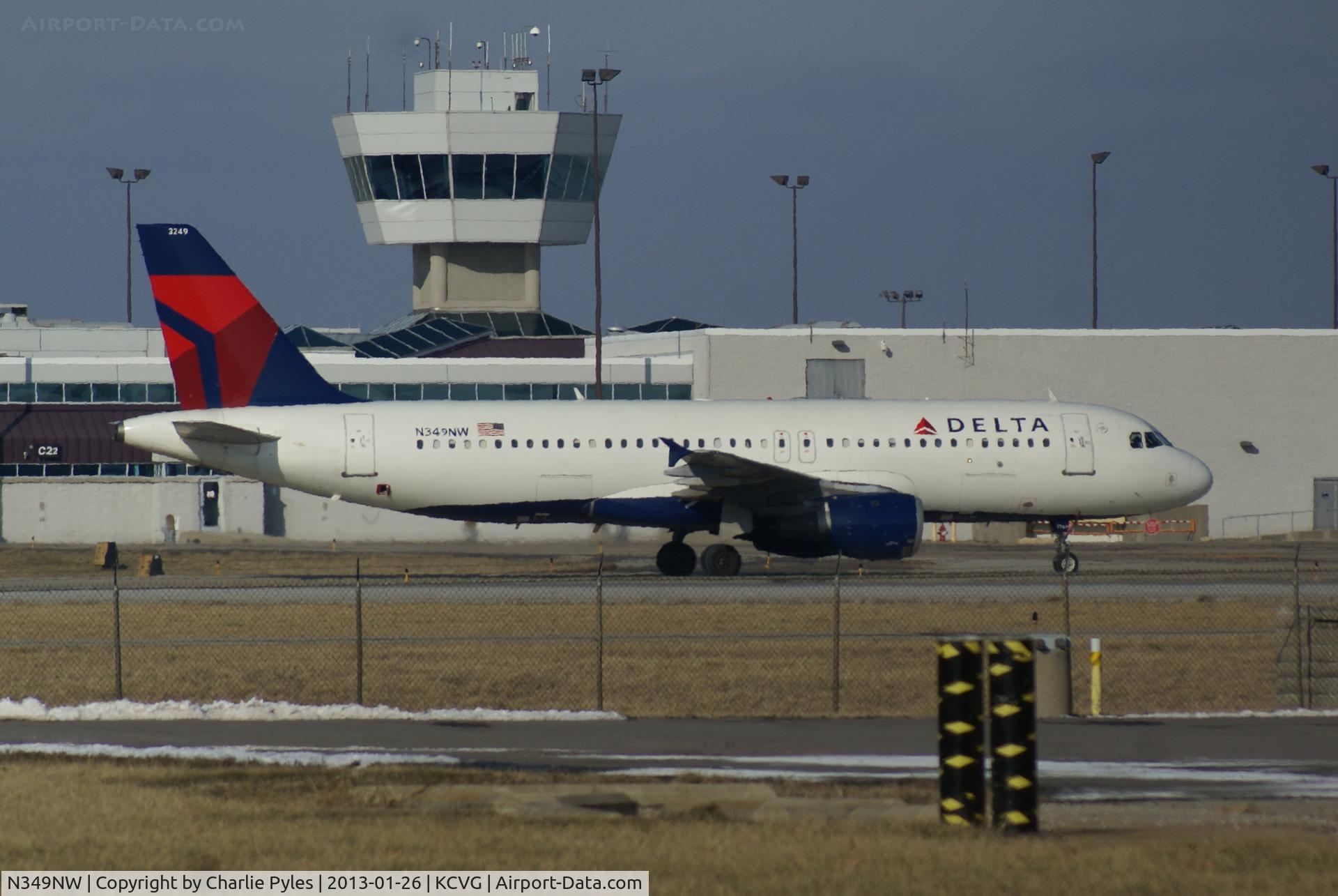 N349NW, 1993 Airbus A320-212 C/N 417, Arriving from Tampa with my daughter and her husband as it taxiies past the former Comair Hub at CVG.