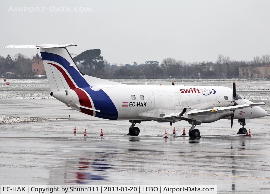 EC-HAK, 1985 Embraer EMB-120RT Brasilia C/N 120008, Parked at the General Aviation area under snow...