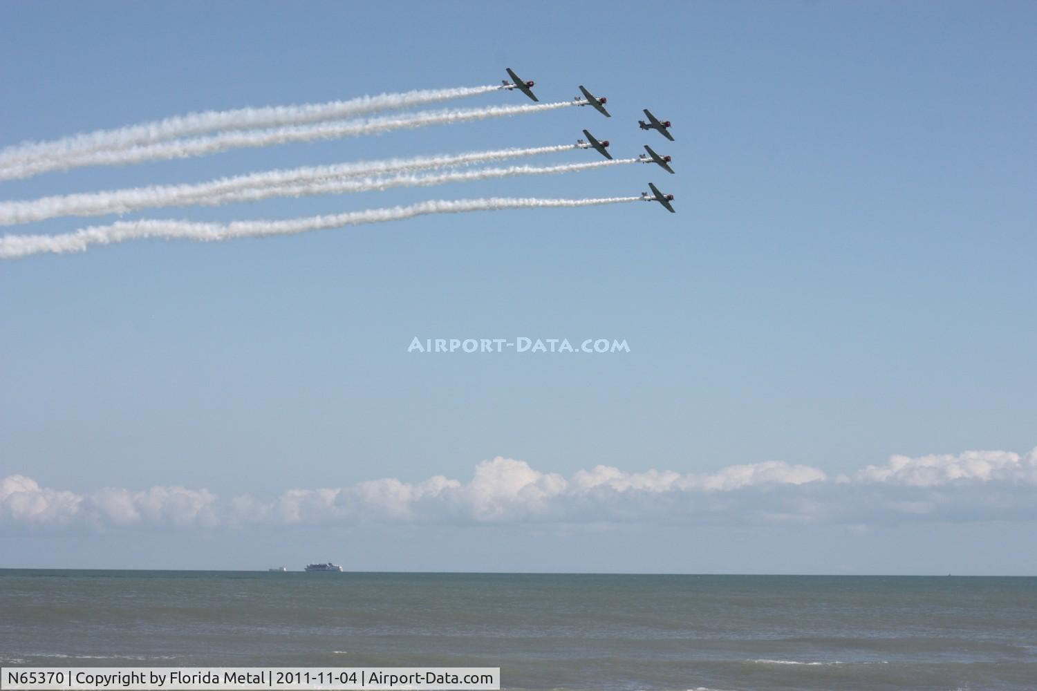 N65370, 1941 North American SNJ-2 Texan C/N 2562, Geico Skytypers over Cocoa Beach