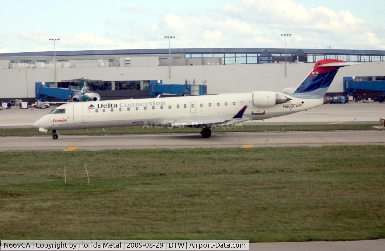 N669CA, 2004 Bombardier CRJ-700 (CL-600-2C10) Regional Jet C/N 10176, Comair CRJ-700 from window of Delta 757 on take off run