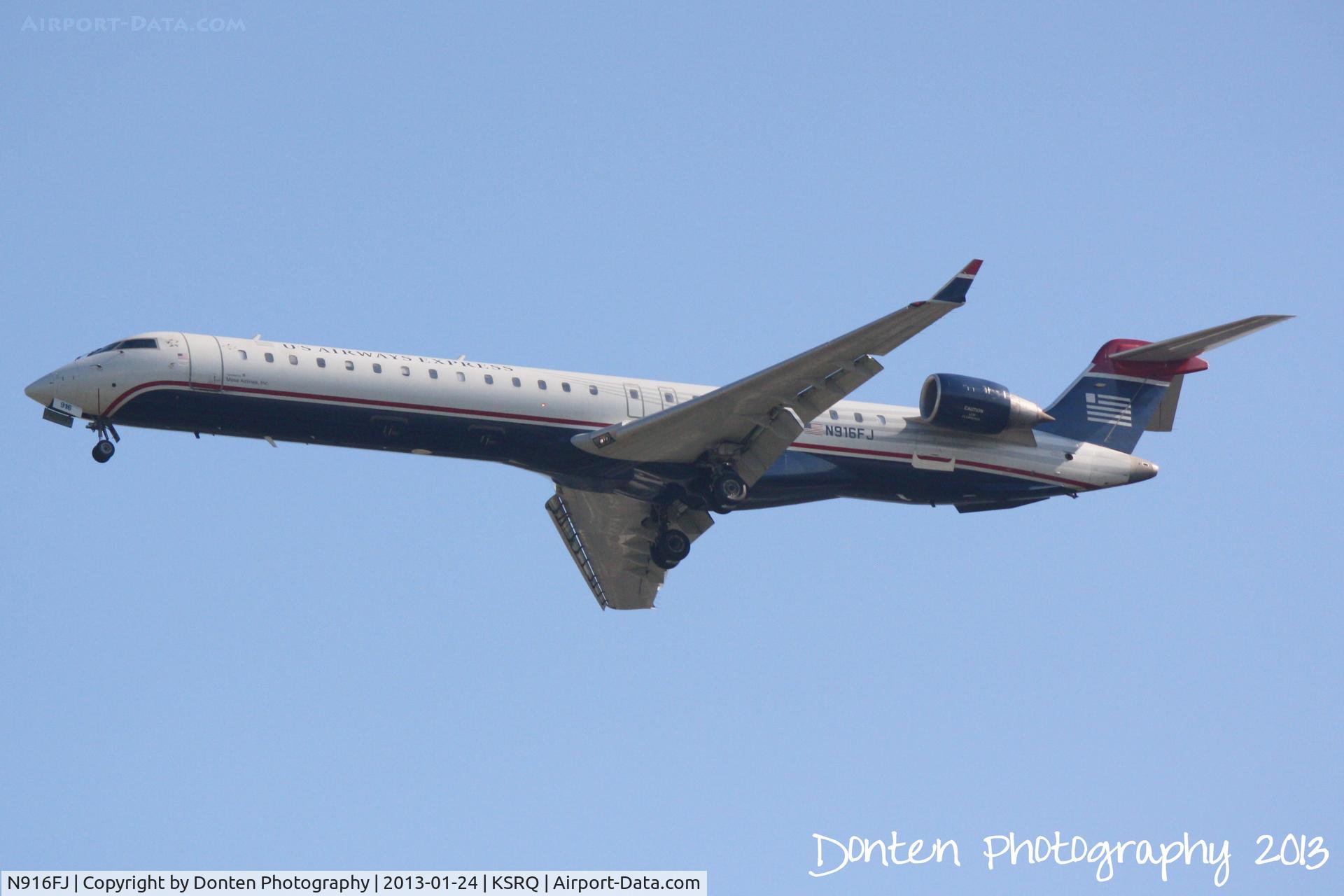 N916FJ, 2004 Bombardier CRJ-900ER (CL-600-2D24) C/N 15016, US Air Flight 2675 operated by Mesa (N916FJ) on approach to Runway 32 at Sarasota-Bradenton International Airport following a flight from Charlotte-Douglas International Airport
