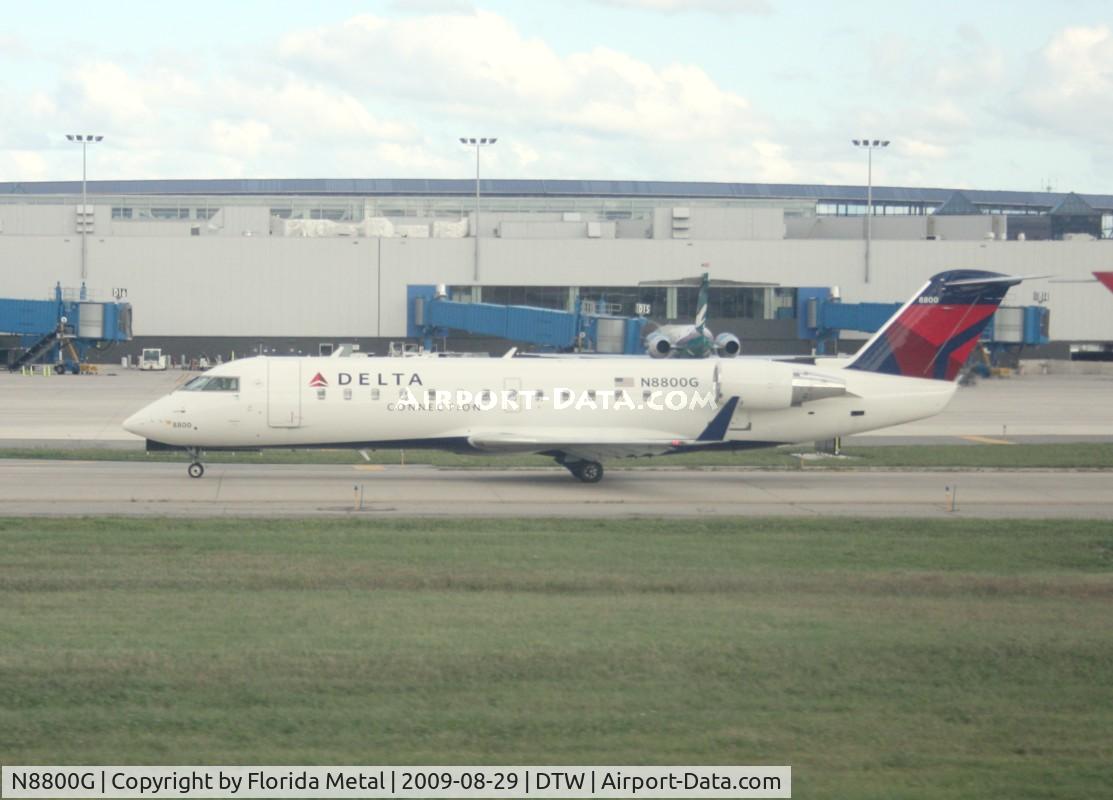 N8800G, 2003 Canadair CRJ-440 (CL-600-2B19) Regional Jet C/N 7800, Pinnacle CRJ-200 waiting to depart taken from window of Delta 757
