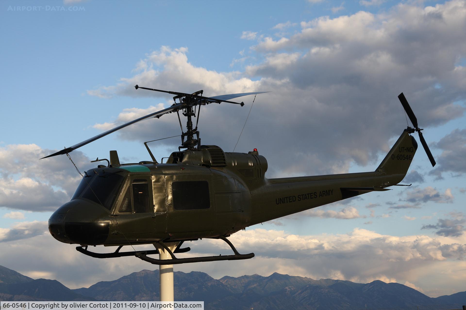 66-0546, 1966 Bell UH-1M Iroquois C/N 1528, Camp Williams, along with SP howitzers