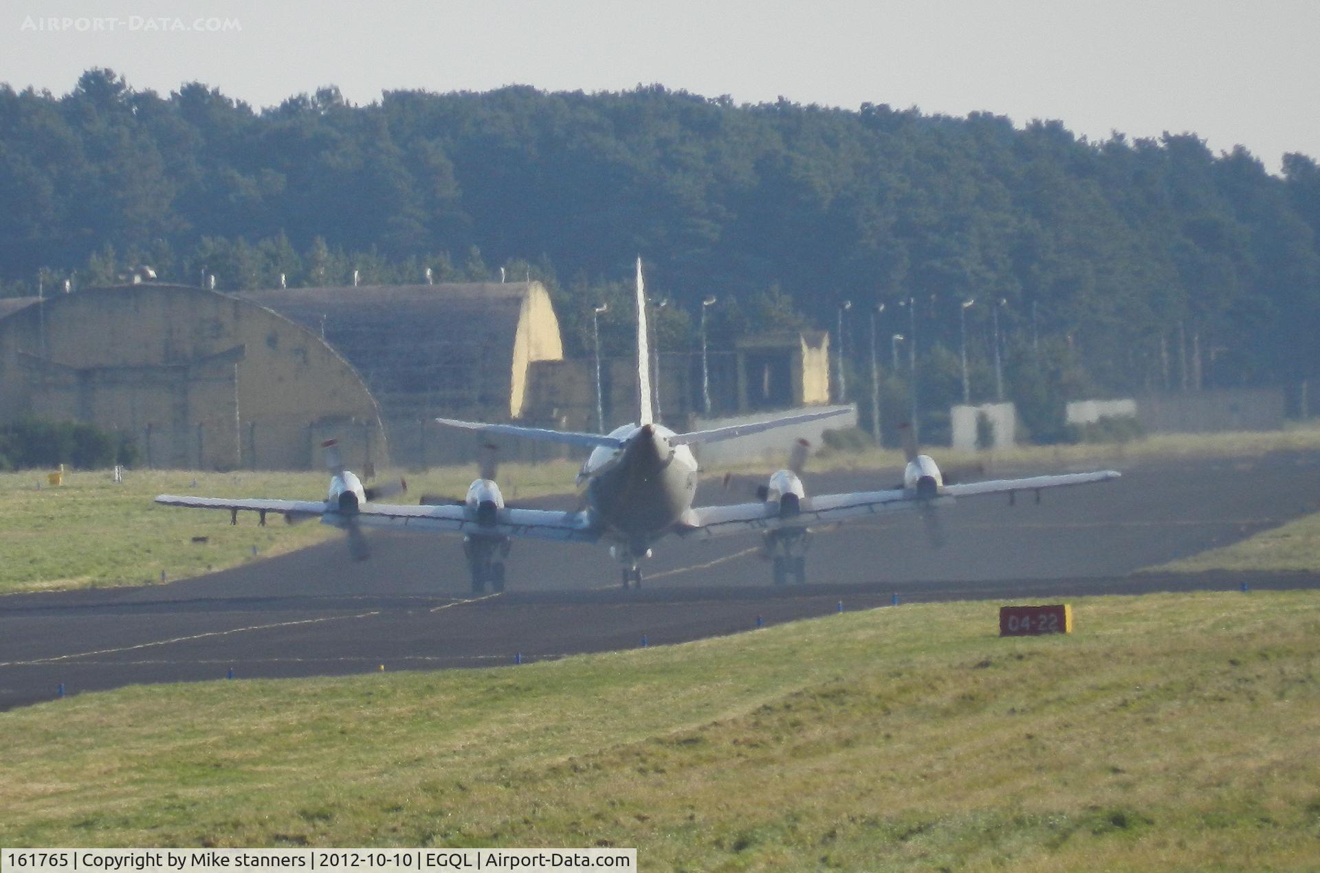 161765, Lockheed P-3C Orion C/N 285G-5779, VP-62 Orion Taxiing out for a joint warrior sortie kicking up a large cloud of smoke from its Four 4,600 hp Allison T-56-A-14 turboprop engines