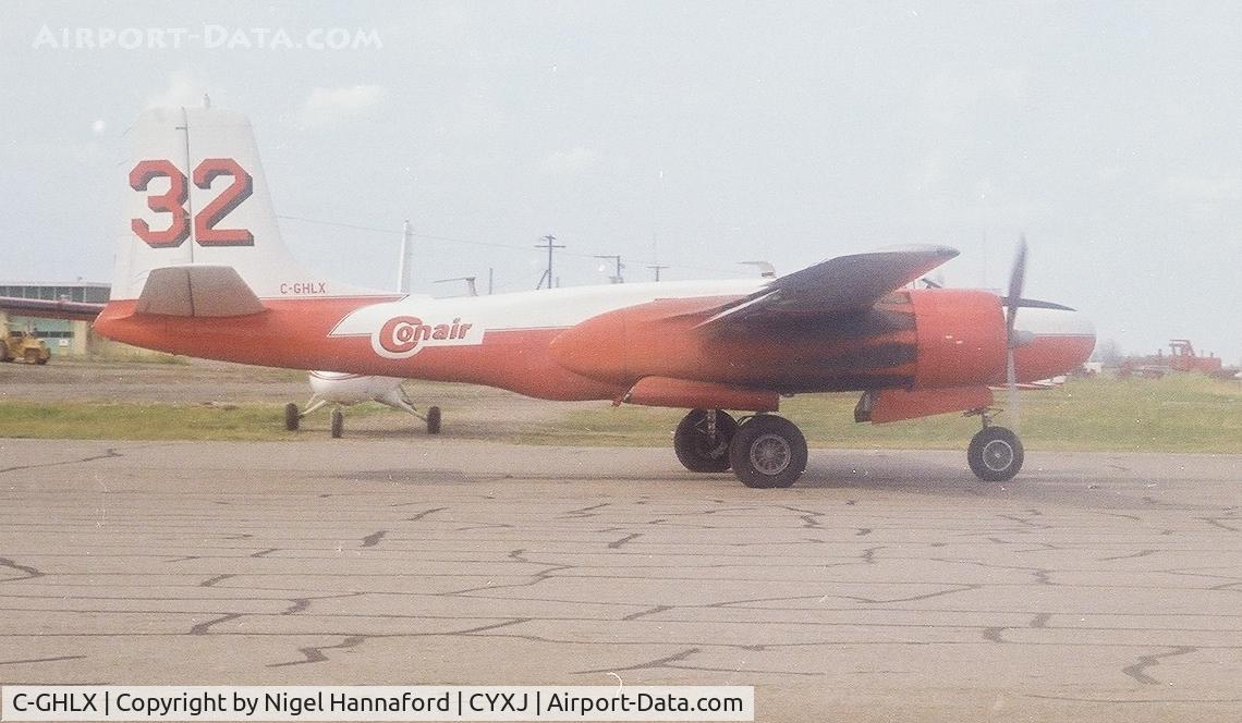 C-GHLX, 1944 Douglas A-26C Invader C/N 29227, One of at least four Con Air aircraft fighting forest fires in northern Alberta, August 1981. Note heavy smoke.