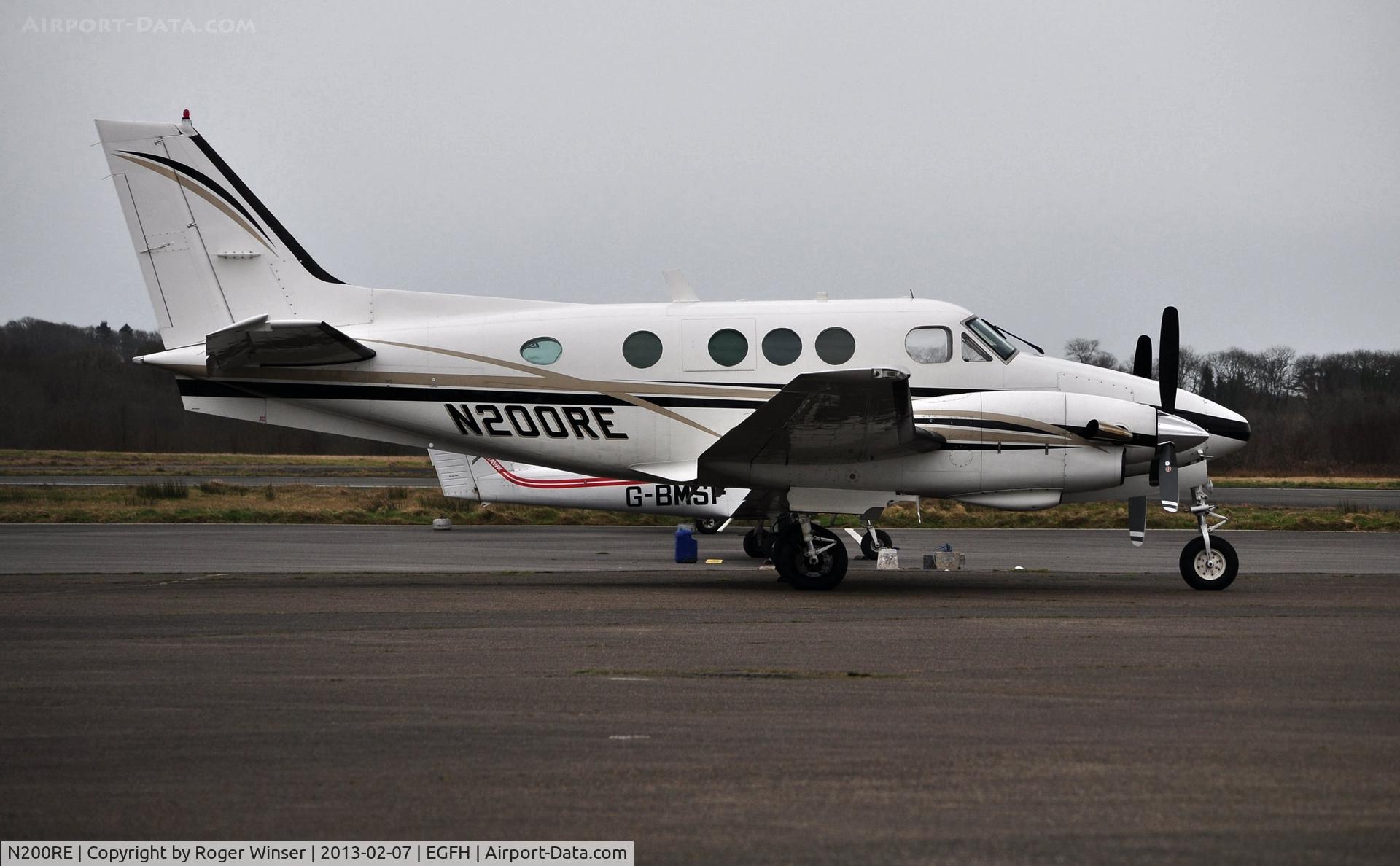N200RE, 1975 Beech E90 King Air C/N LW-164, Visiting Beech King Air basking in the rain.