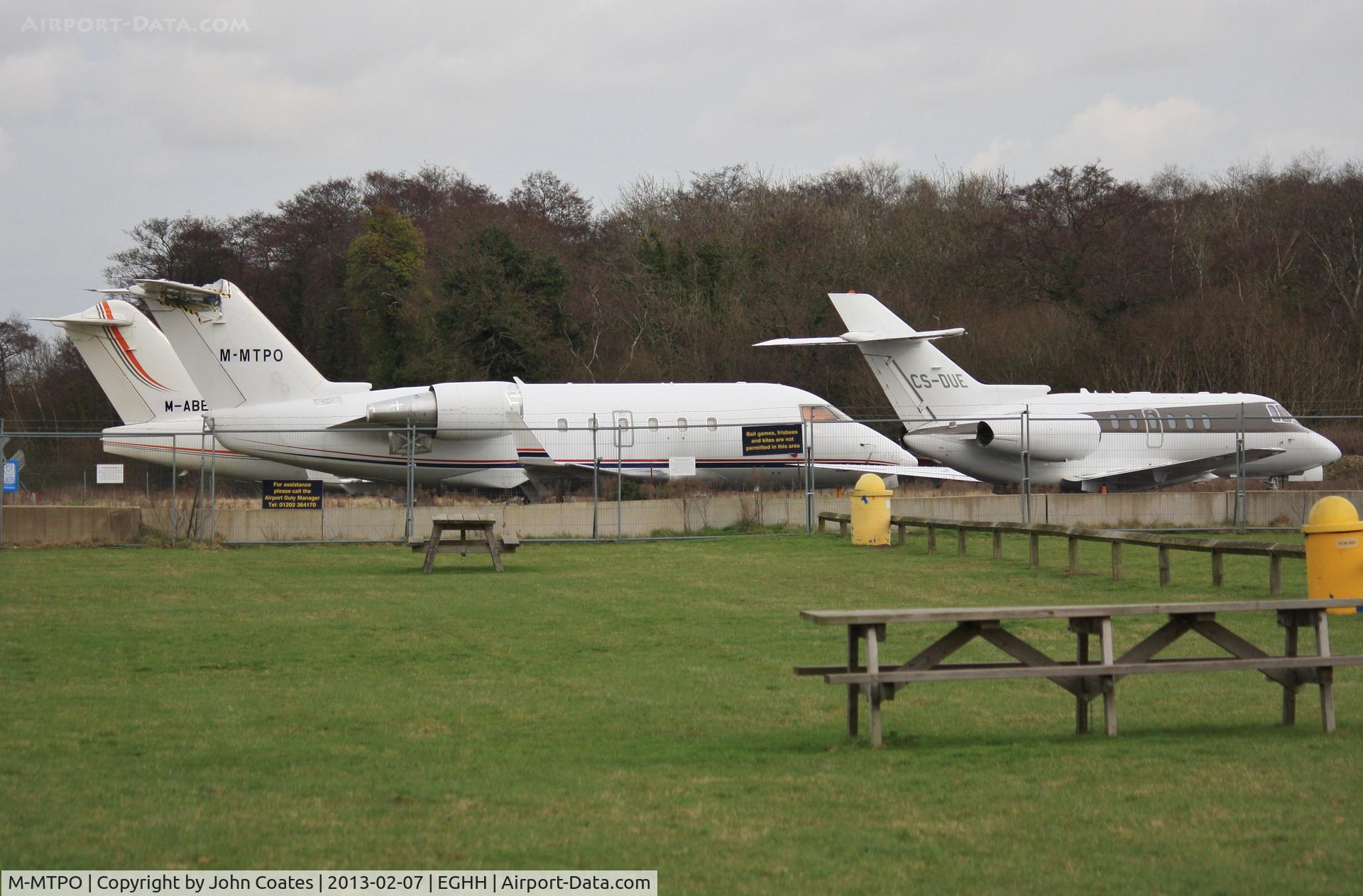 M-MTPO, 1988 Canadair Challenger 601 (CL-600-2A12) C/N 3033, JETS apron with M-ABEI and CS-DUE from viewing area.