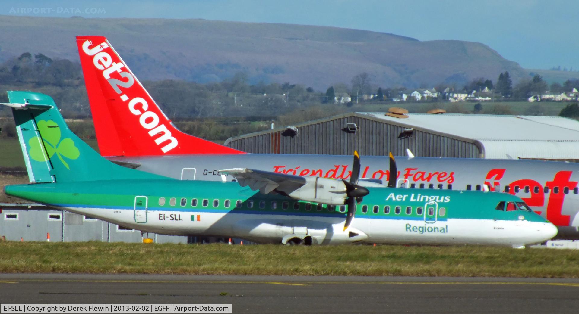 EI-SLL, 1994 ATR 72-212 C/N 387, From Dublin, rugby supporters for International in cardiff, in the background is G-CELF also from Dublin.