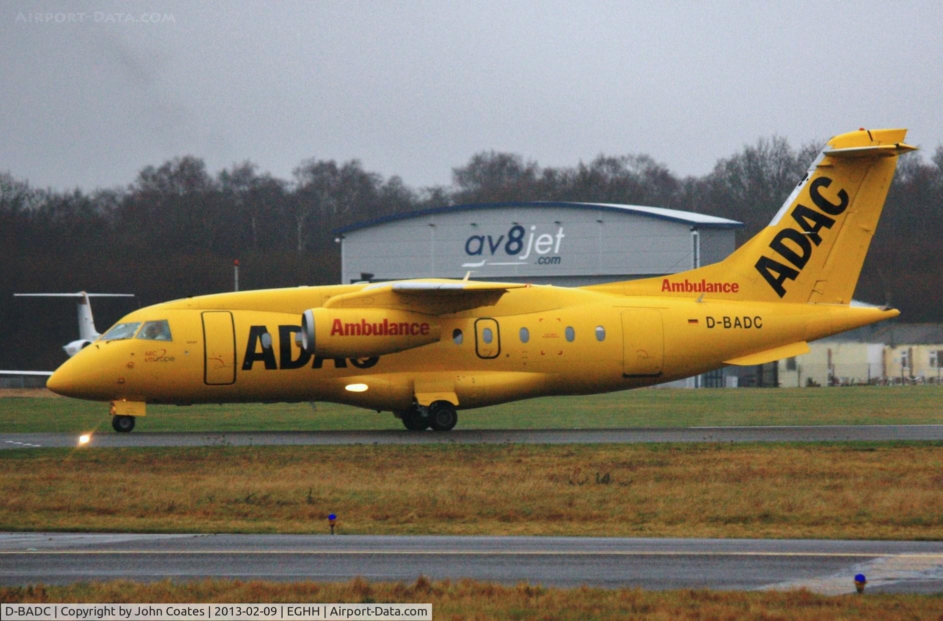 D-BADC, 2003 Dornier Do328JET C/N 3216, Air Ambulance flight departs in thick drizzle