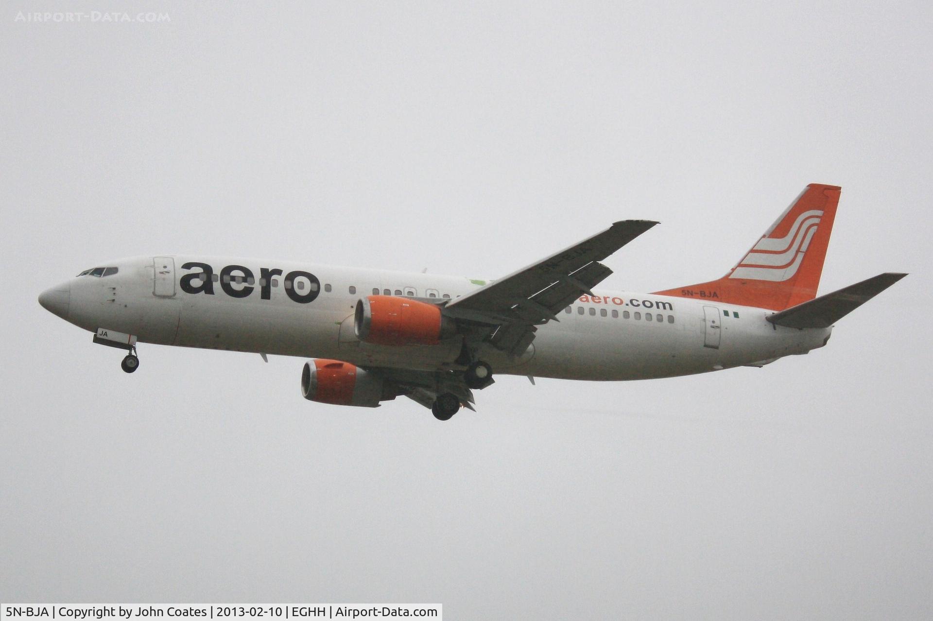 5N-BJA, 1990 Boeing 737-4B7 C/N 24873, Arriving from Lasham in heavy rain and mist for a respray