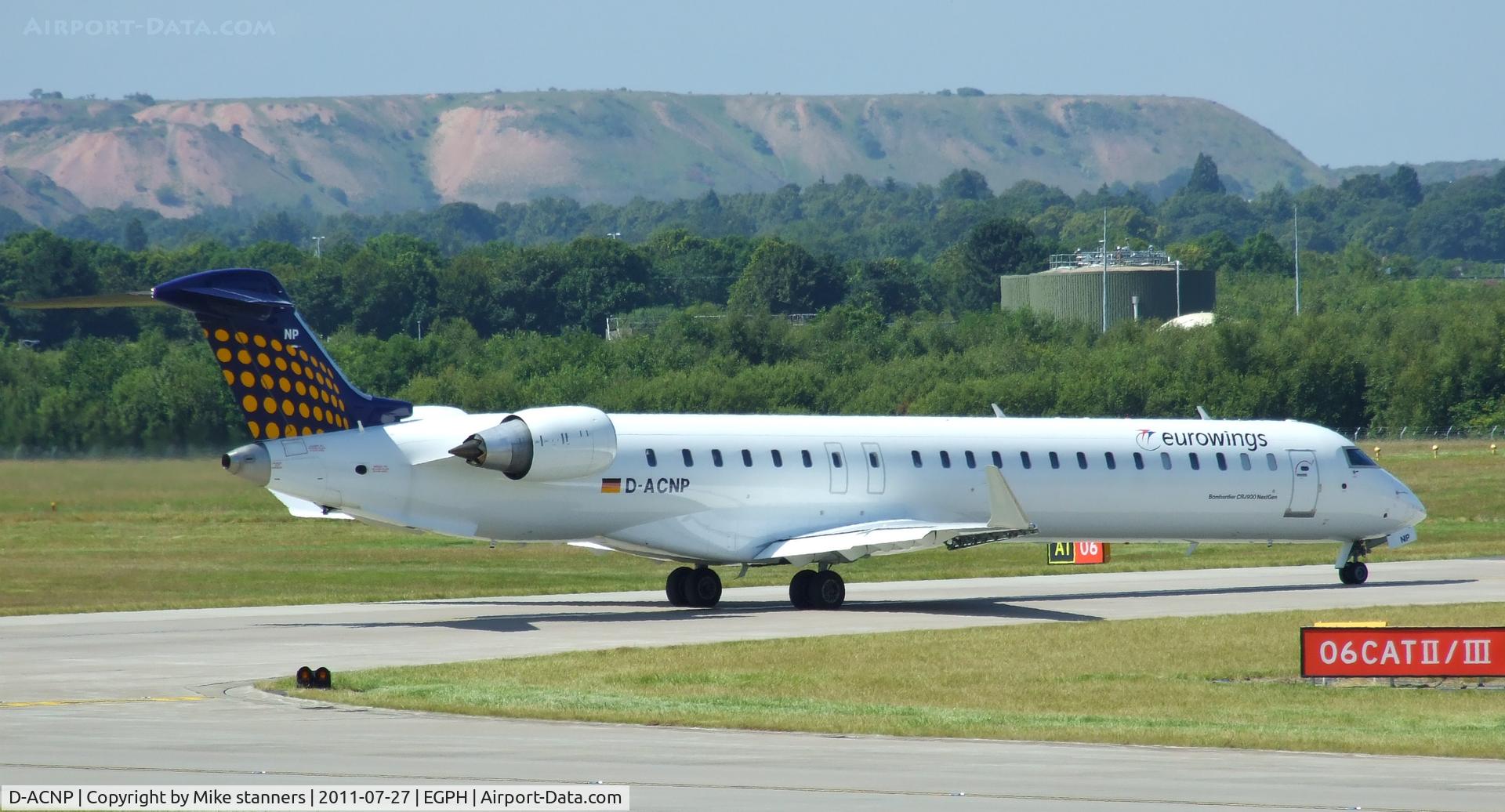 D-ACNP, 2010 Bombardier CRJ-900LR (CL-600-2D24) C/N 15259, “Lufthansa 5MK” waiting to enter runway 06 For departure back to DUS