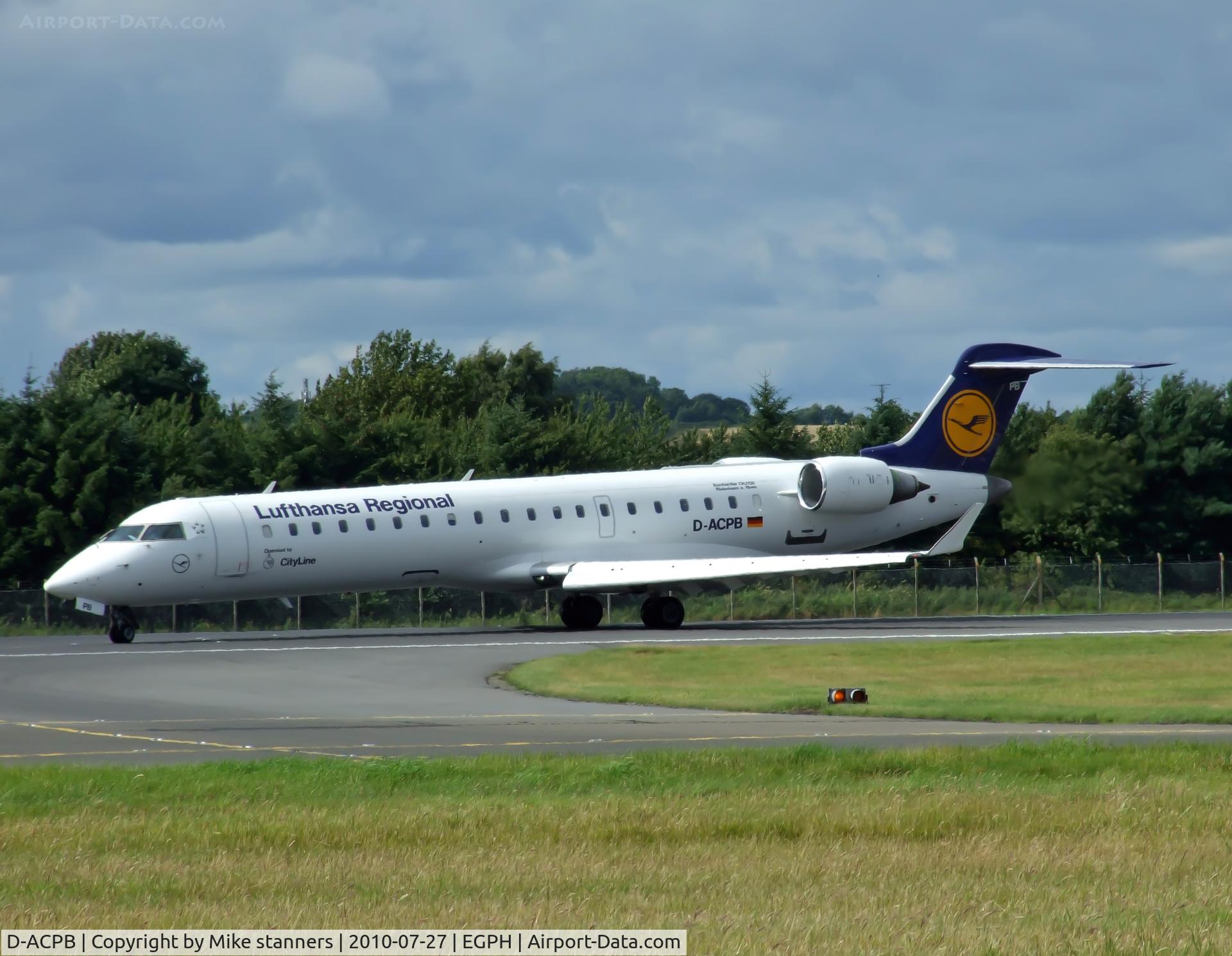 D-ACPB, 2001 Canadair CRJ-701ER (CL-600-2C10) Regional Jet C/N 10013, “Lufthansa 4948” Turning off runway 24 and onto taxiway bravo 1