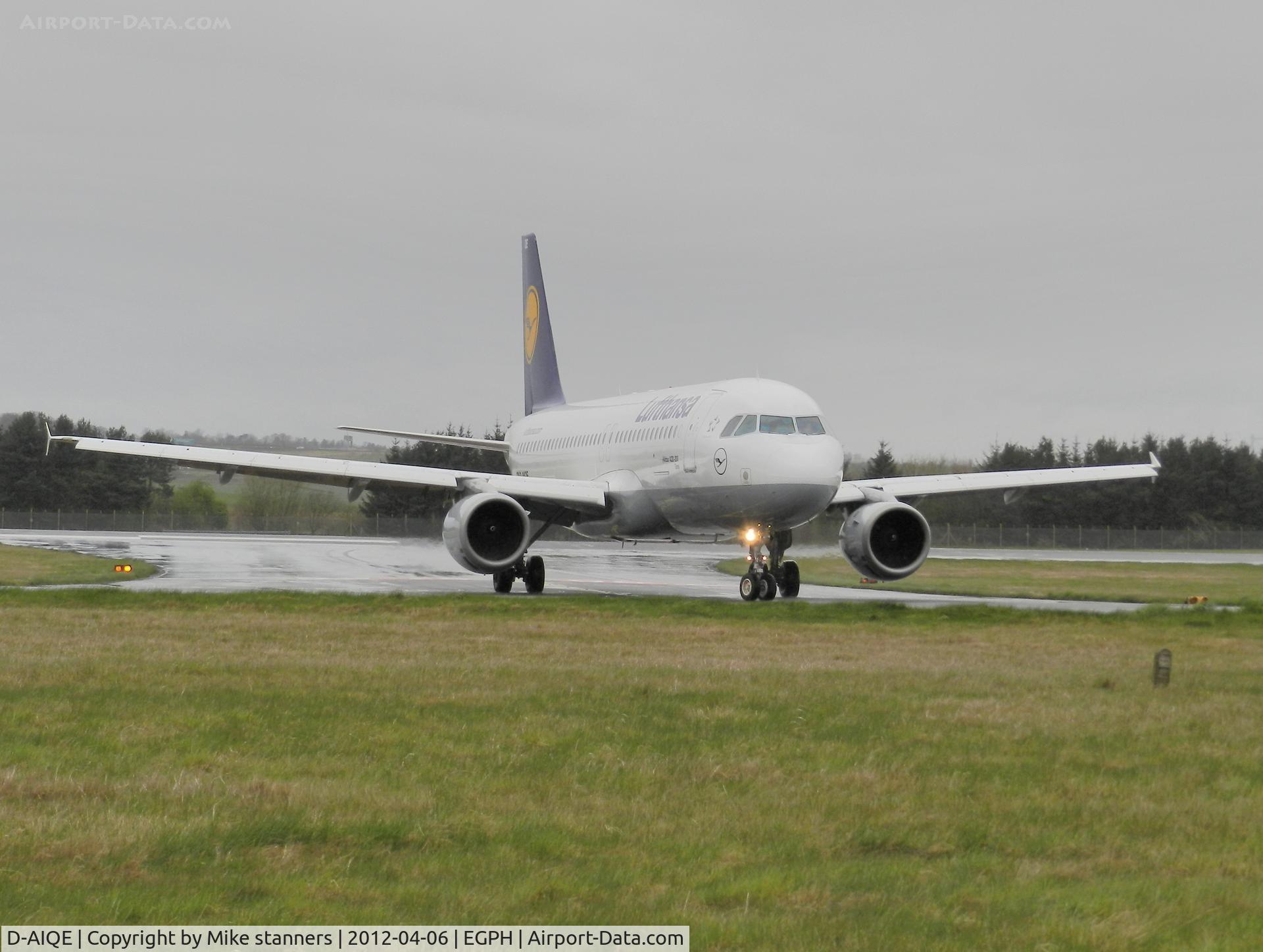 D-AIQE, 1991 Airbus A320-211 C/N 0209, “Lufthansa 1YF”  on taxiway bravo 1 at a very wet and miserable Edinburgh airport