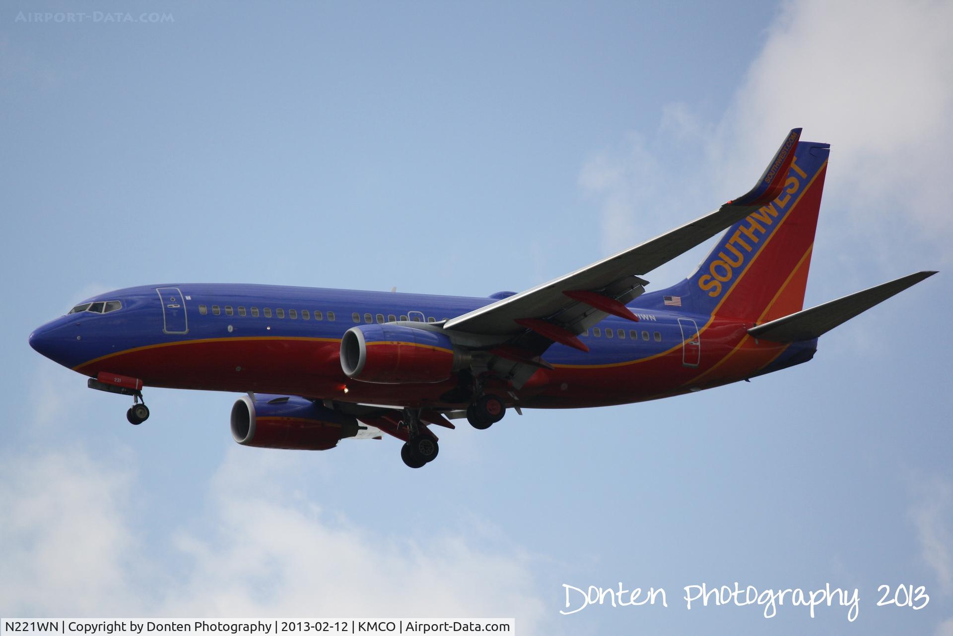 N221WN, 2005 Boeing 737-7H4 C/N 34259, Southwest Flight 469 (N221WN) arrives at Orlando International Airport following a flight from Nashville International Airport