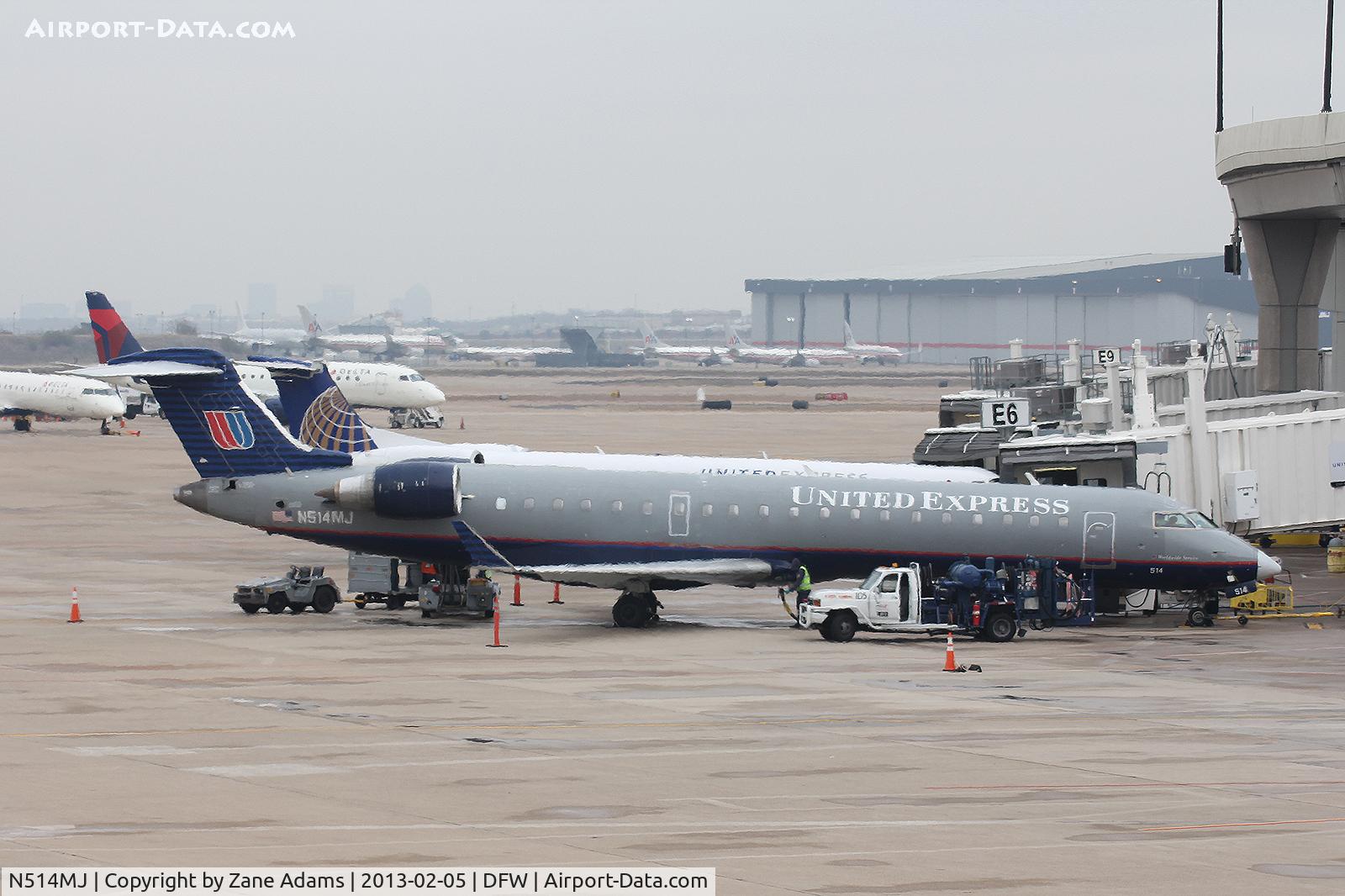 N514MJ, 2003 Bombardier CRJ-700 (CL-600-2C10) Regional Jet C/N 10116, At the gate - DFW Airport