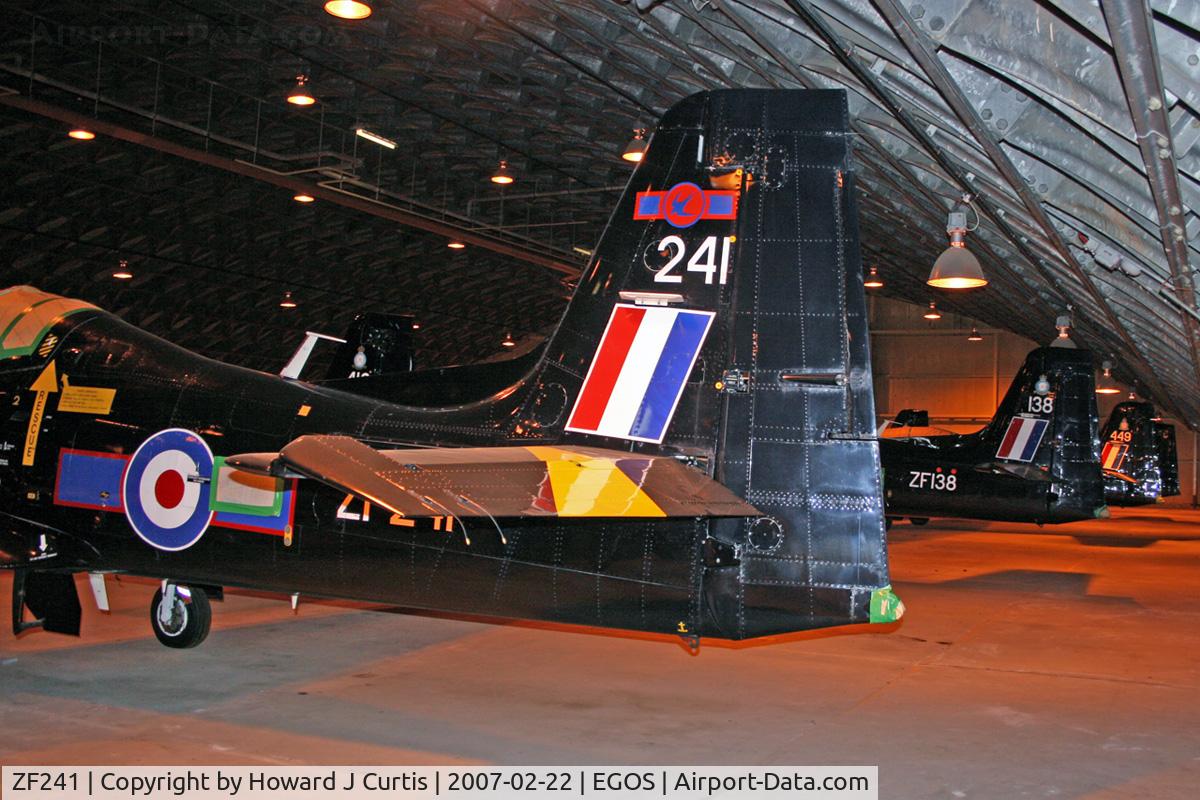 ZF241, 1990 Short S-312 Tucano T1 C/N S044/T41, Royal Air Force, in store. The tails of ZF241, ZF138 and ZF449.