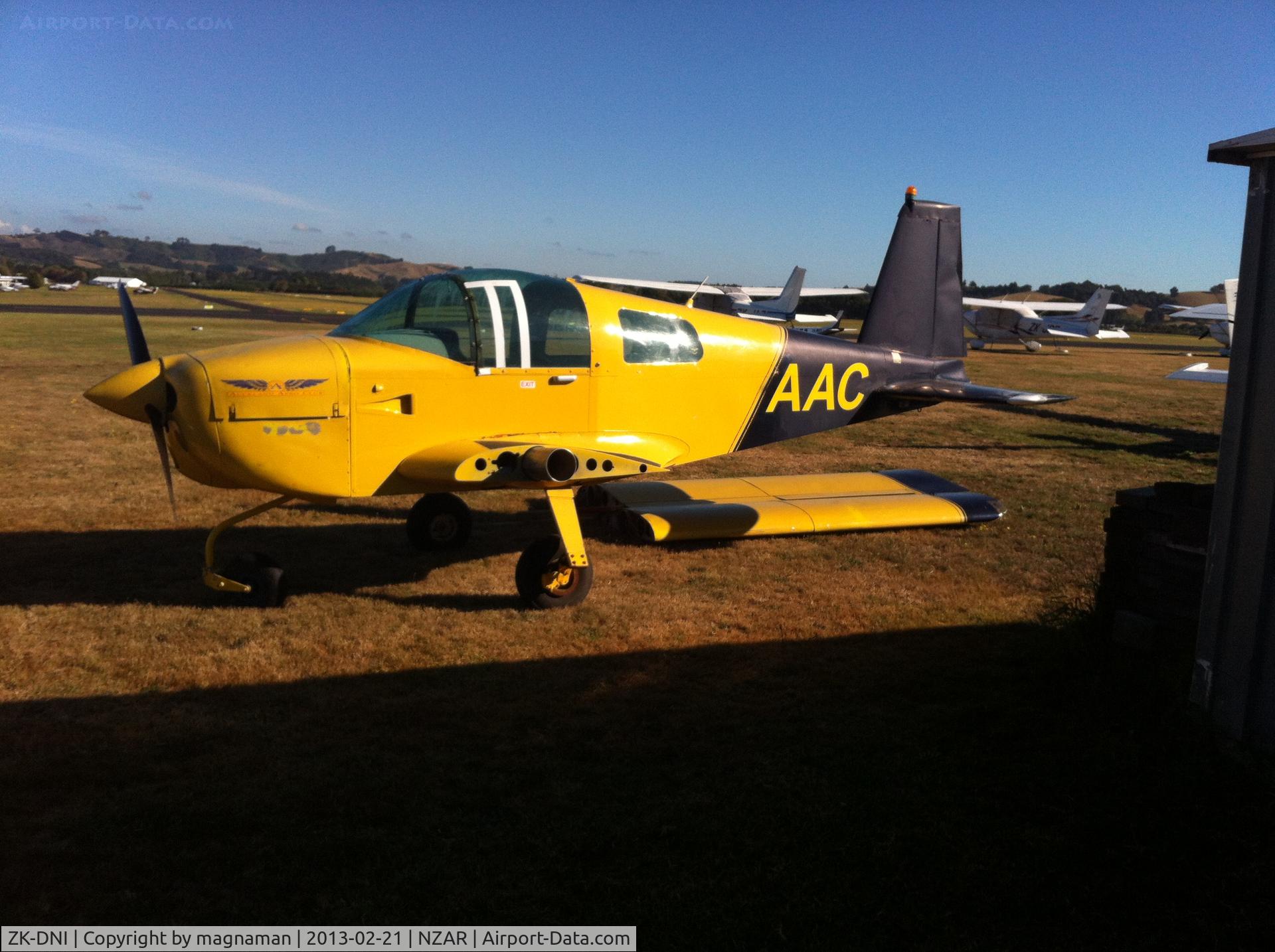ZK-DNI, Grumman American AA-1B Trainer C/N AA5B-0136, This grumman has been just a visible tail sticking out of a metal hut for at least the past year. Saw today in all its glory. The registration is not correct as used as advert for the Auckland Aero Club (AAC). True identity is ZK-DNI c/n AA1B-0136